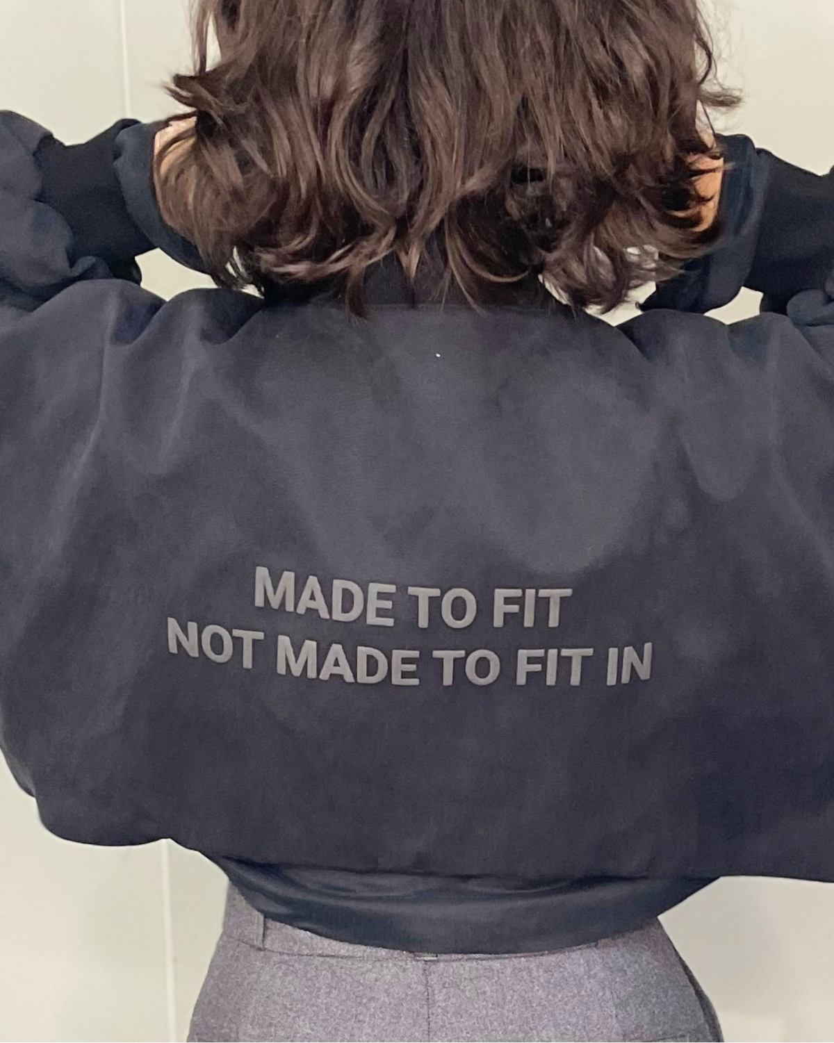 Cropped Bomber dark text 4