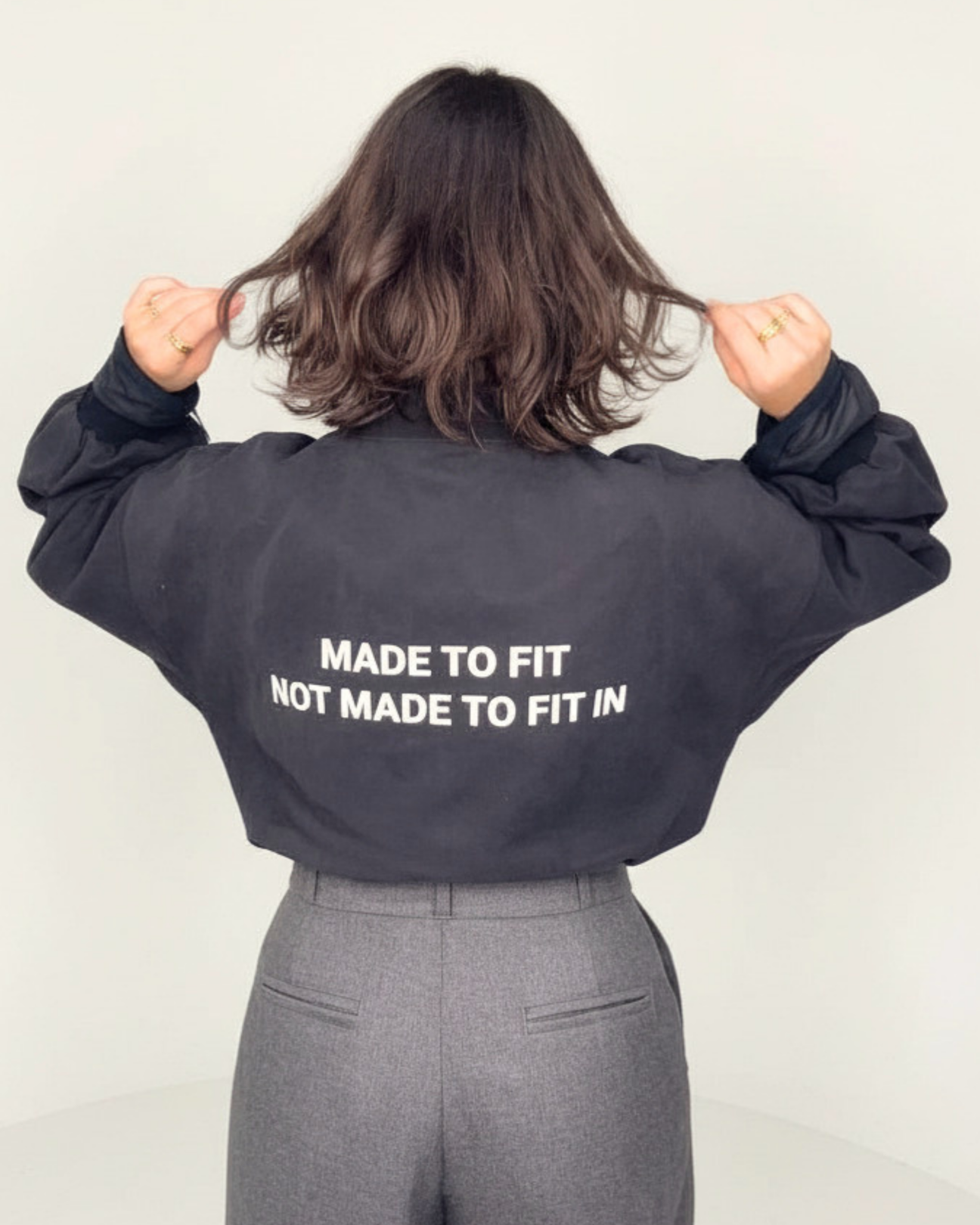 Cropped bomber white text 4