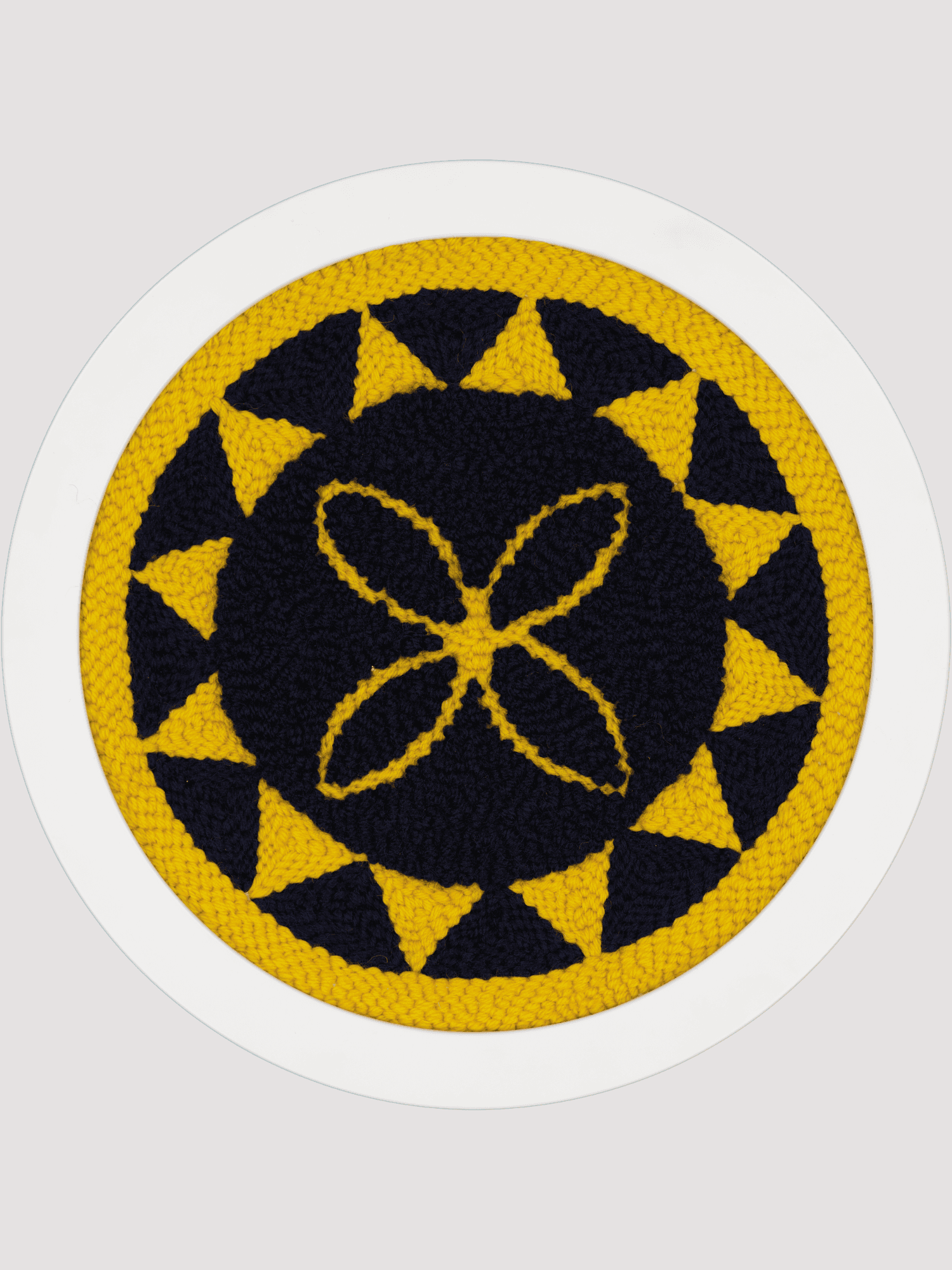 Yellow and navy polynesian round art piece with flower motif