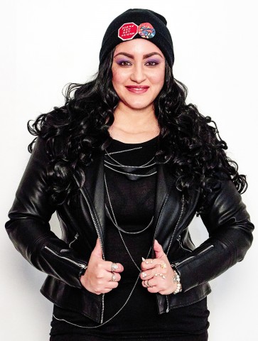 Anastasia Rickard wearing a black leather jacket and black beanie